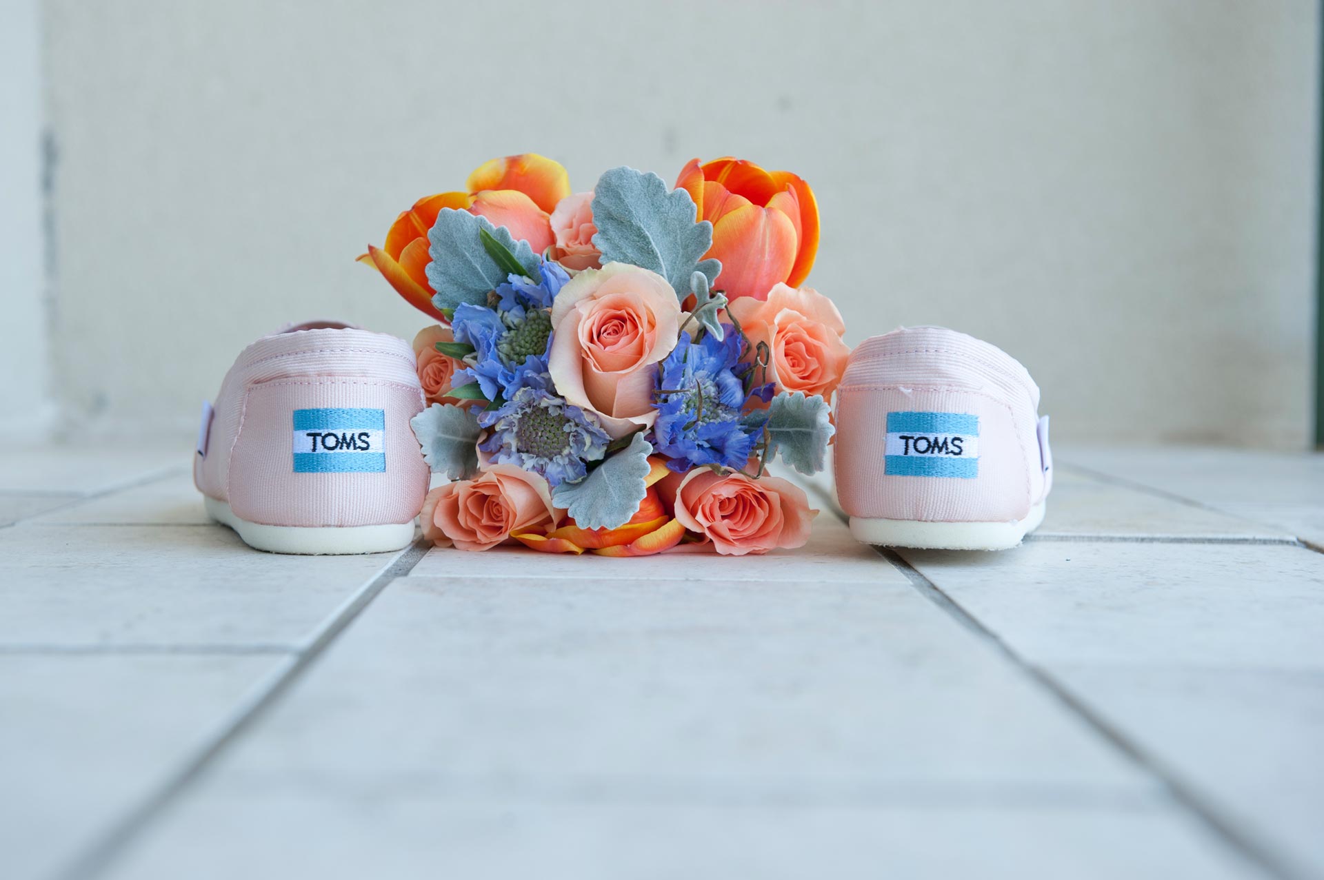 Flowers arranged on top of the Bride's shoes