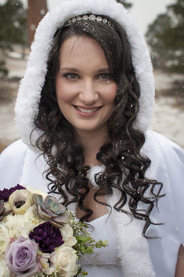the Bride's smiling with the snow starting to fall